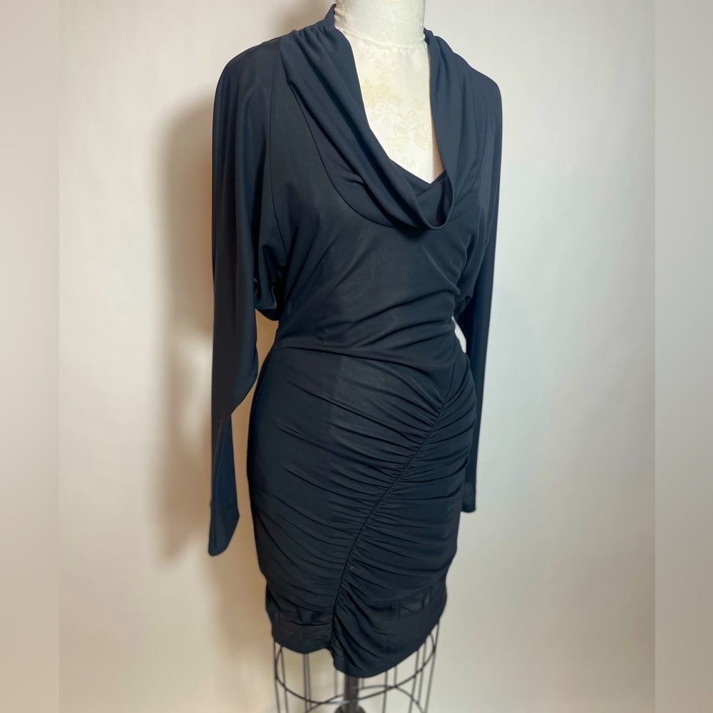 Used black dress size small, cow neck, long sleeve with opening back and zipper